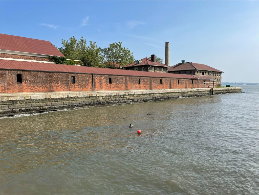 Completed section of the Ellis Island Seawall seen at low tide, 2023. NPS photo